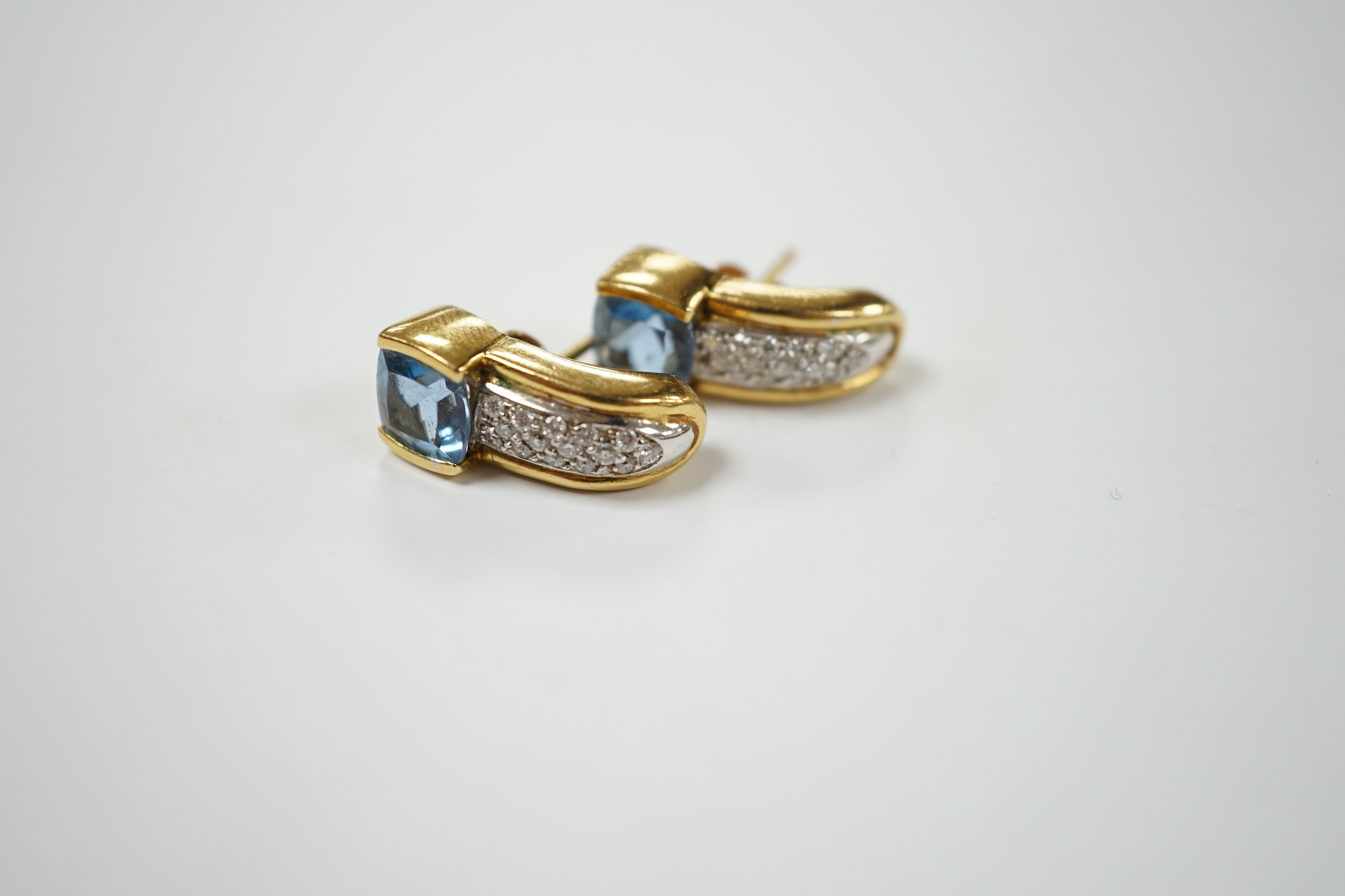 A modern pair of yellow metal and single stone fancy cut aquamarine and diamond chip cluster set earrings, 17mm, gross weight 10.6 rams. Condition - good
